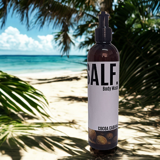 Bottle of SALF. Body Wash with a beach and palm trees in the background